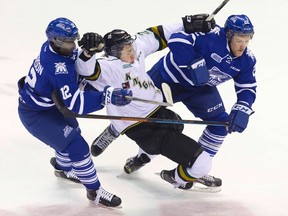 Knight Chandler Yakimowicz is double-teamed by Mississauga?s Marcus Dickerson, left, and Brandon Devlin in the first period Friday. Devlin drew a penalty, leading to a Mitch Marner power-play goal. (DEREK RUTTAN, The London Free Press)