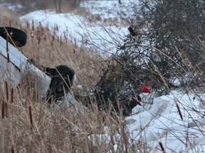A car was over turned in a ditch on Swale Road near Ottawa Friday Nov 21,  2014. One person was taken to hospital. Tony Caldwell/Ottawa Sun/QMI Agency