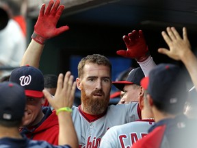 Washington Nationals first baseman Adam LaRoche (25) is congratulated in the dugout after hitting a two-run home run against the New York Mets during the first inning at Citi Field on Aug 14, 2014 in New York, NY, USA. (Adam Hunger/USA TODAY Sports)
