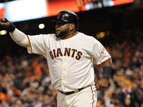 San Francisco Giants third baseman Pablo Sandoval reacts after scoring a run against the Kansas City Royals in the 8th inning during game five of the 2014 World Series at AT&T Park on Oct 26, 2014 in San Francisco, CA, USA. (Christopher Hanewinckel/USA TODAY Sports)