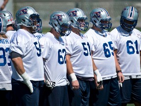 The Alouettes offensive line Jeff Perrett, Jake Piotrowski, Kristian Matte, Simon Légaré and Ryan White during training at the Montreal Parc Hébert Tuesday on August 26 2014. (MARTIN CHEVALIER/QMI AGENCY)