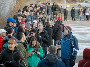 Fans cue for 'Beat the Bot's Foo Fighters tickets at the Scotiabank Saddledome in Calgary, Alta., on Saturday, Nov. 22, 2014. Almost 900 people showed up to cue for tickets that would pre-empt automated sales for the Aug. 13, 2015 show. Lyle Aspinall/Calgary Sun/QMI Agency