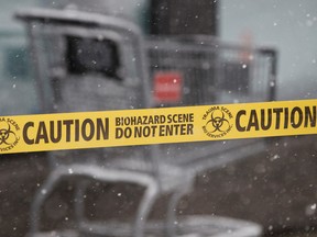 Caution tape placed by Trauma Scene Bio Services personnel is seen in front of a Dollarama store at Manning Town Centre at 153 Avenue and 37 Street in Edmonton, Alta., on Saturday, Nov. 22, 2014. A shooting occurred near the store on Friday night. Ian Kucerak/Edmonton Sun/ QMI Agency