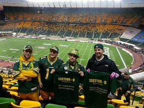 Section O co-founder Matt Machado, second right, poses for a photo with Edmonton Eskimos quarterback Matt Nichols, right, at Commonwealth Stadium on Nov. 16, 2014. PHOTO SUPPLIED/TWITTER