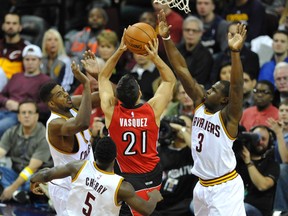 Raptors guard Greivis Vasquez puts up a shot against the Cavaliers in Cleveland on Saturday night. (USA TODAY SPORTS)
