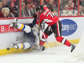 Nov 22, 2014; Ottawa, Ontario, CAN; St. Louis Blues right wing Ryan Reaves (75) is checked by Ottawa Senators defenseman Mark Borowiecki (74) in the first period at the Canadian Tire Centre. Mandatory Credit: Marc DesRosiers-USA TODAY Sports