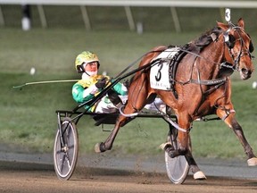 JK She’salady, with Tim Tetrick driving, cruises to the finish line to win her Breeders Crown division on Saturday night at the Meadowlands. The two-year-old filly is the favourite for horse of the year in North America after her perfect 12-race campaign. (Michael Lisa/Photo)