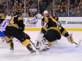 Nov 22, 2014; Boston, MA, USA; Montreal Canadiens center Tomas Plekanec (14) scores a goal past Boston Bruins goalie Tuukka Rask (40) during the first period at TD Banknorth Garden. Mandatory Credit: Bob DeChiara-USA TODAY Sports