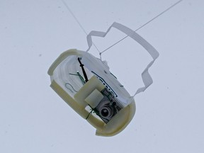 A GoPro camera attached to a kite string rises into the air during an aerial mapping workshop at the University of Alberta in Edmonton, Alta., on Saturday, Nov. 22, 2014. Codie McLachlan/Edmonton Sun/QMI Agency