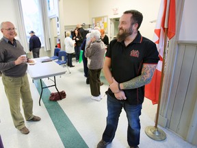 Bosnia and Afghanistan veteran with the Second Battalion of the Princess Patricia Canadian Light Infantry, David McFaul, 38, answers questions from members of The Seventh Town Historical Society in Ameliasburgh, Ont. after he spoke about his experience of participating in the 2014 Battlefield Bike Ride in France last summer in support of Wounded Warriors Canada, Saturday, Nov. 22, 2014. - JEROME LESSARD/THE INTELLIGENCER/QMI AGENCY