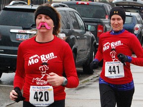Wallaceburg runners Karen Eddleston, left, and Kelly Helbin were among 180 taking part in the third annual Mo' Run Movember fundraiser Sunday in Sarnia. Eddleston was one of several women sporting fake moustaches for the run. TYLER KULA/ THE OBSERVER/ QMI AGENCY