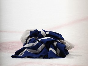 A Toronto Maple Leafs jersey lies on the ice in the closing minutes of a 9-2 defeat at the hands of the Nashville Predators at the Air Canada Centre on Nov. 18. (GETTY IMAGES/AFP)
