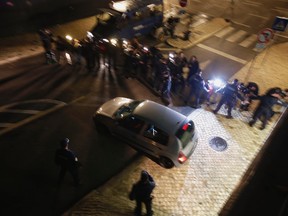 Police keep members of the media back as Portugal's former Socialist prime minister Jose Socrates leaves the court inside a car in Lisbon November 23, 2014. REUTERS/Rafael Marchante