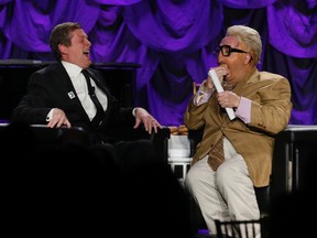 John Tory laughs as he shares the limelight with celebrity interviewer Jiminy Glick -- aka Martin Short -- at the 2014 Negev dinner on Friday, Nov. 24, 2014. (STAN BEHAL/Toronto Sun)