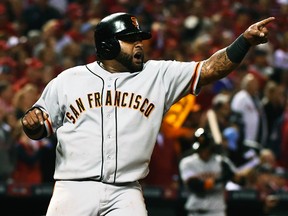 San Francisco Giants third baseman Pablo Sandoval scores against the St. Louis Cardinals in Game 2 NLCS at Busch Stadium in St. Louis, Oct. 12, 2014. (USA Today)