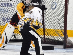 Molly Snyders of the Mitchell U10 ringette team fires the ring high over the outstretched arm of the Waterloo goaltender during action from last Thursday’s round robin play in the 31st annual Mitchell Stingers ringette tournament. The locals would lose, 8-2. ANDY BADER/MITCHELL ADVOCATE