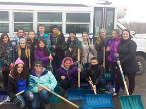 Students from H.W. Pickup who volunteer for the Snow Angels program pose for a picture with shovels in their hands, ready for any white stuff coming this winter.