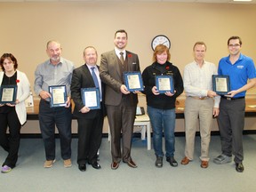 Winners of the 2014 City of Sarnia Accessibility Awards stand with their plaques after receiving them during the Nov. 10 city council meeting.
CARL HNATYSHYN/SARNIA THIS WEEK/QMI AGENCY