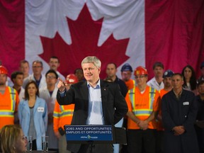 Prime Minister Stephen Harper announces new infrastructure investments across Canada at The Collider Centre  in London, Ontario on Monday, November 24, 2014.  DEREK RUTTAN/ The London Free Press /QMI AGENCY
