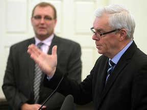 Education Minister Peter Bjornson (left) looks on as Premier Greg Selinger  announced the elimination of interest rates on student loans at a press conference on Monday. (Brian Donogh/Winnipeg Sun)