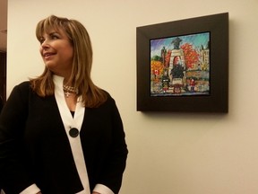 Artist Katerina Mertikas was in the mayor's boardroom at Ottawa City Hall on Monday, Nov. 24, 2014 helping unveil an original painting that honours murdered soldier Cpl. Nathan Cirillo. Proceeds from sales of the print will go to Cirillo's five-year old son. 
JON WILLING/OTTAWA SUN/QMI AGENCY