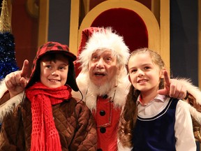 JOHN LAPPA/THE SUDBURY STAR    
Samuel Leach Jarrett, left, plays Mortimer and Tommy, Walter Learning is Kris Kringle and Sofie Mais is Susan Walker in the Sudbury Theatre Centre production of Miracle on 34th Street.