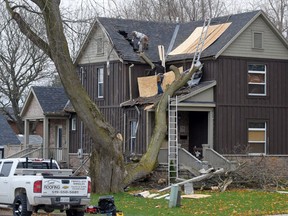 A house on the corner of Lisgar Avenue and First Street in Tillsonburg was damaged by a section of a tree that came down during yesterday's high winds. (CHRIS ABBOTT/TILLSONBURG NEWS)
