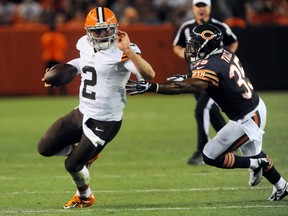 Cleveland Browns quarterback Johnny Manziel runs from Chicago Bears safety Marcus Trice during the third quarter at FirstEnergy Stadium on Aug. 28, 2014. (Ken Blaze-USA TODAY Sports/Files)