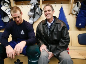 David Booth with his dad, Mike, at the Toronto Maple Leafs practice at the Mastercard Centre in Tuesday, Nov. 25, 2014. (STAN BEHAL/Toronto Sun)