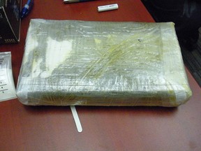 A brick of suspected cocaine wrapped in plastic is shown in this photo supplied by the Canada Border Services Agency and the Royal Canadian Mounted Police.
