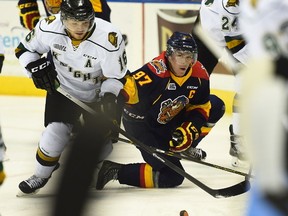 Erie Otters forward Connor McDavid fights for the puck with London Knights forward Max Domi. (Aaron Bell/OHL Images)