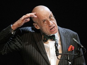 US writer James Ellroy gestures as he reads from his novel "Underworld USA" at the Theatre du Rond-Point in Paris, on January 11, 2010. AFP PHOTO, PIERRE VERDY