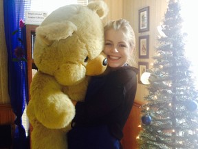 Nancy Neufeld from Indigo Lounge in Tillsonburg holds a giant Teddy Bear donated to Power of Hope. (CONTRIBUTED PHOTO)