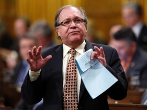 Canada's Aboriginal Affairs Minister Bernard Valcourt speaks during Question Period in the House of Commons on Parliament Hill in Ottawa November 25, 2014. REUTERS/Chris Wattie