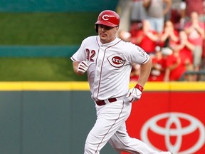 Cincinnati Reds right fielder Jay Bruce rounds the bases after he hit a solo home run in the first inning at Great American Ball Park in Cincinnati on Aug. 9, 2014. (DAVID KOHL/USA TODAY Sports)