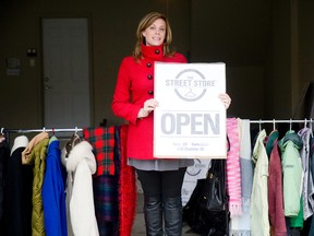 Marsi Breemhaar shows off the collection of donated clothing that will be available at The Street Store, a South African philanthropic movement to help aid the homeless, in her home in London on Tuesday November 25, 2014.  Breemhaar will be set up on Saturday from 9 a.m. to 2 p.m. rain or shine at 450 Dundas Street for the one-day pop up event that invites the homeless and resource-challenged to choose up to 3 items to create an outfit.
CRAIG GLOVER The London Free Press / QMI AGENCY