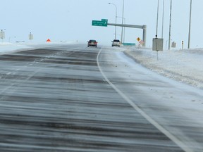 Snow is seen blowing across the north bound lanes of the Anthony Henday south of 127 Street on Tuesday Nov. 19, 2013 in Edmonton, Alta. City crews and contractors are struggling to keep up the recent days of snowfall, large parks of the city are still awaiting sanding, plowing and snow removal. Tom Braid/Edmonton Sun