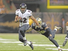 Baltimore Ravens receiver Torrey Smith eludes a tackles from New Orleans Saints safety Kenny Vaccaro during Monday’s game. (USA TODAY SPORTS)