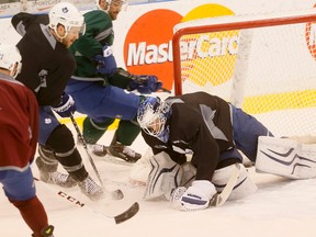 James Reimer cover the puck at Leafs practice on Tuesday. (Stan Behal/Toronto Sun)