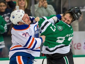 Oilers forward Matt Hendricks trades blows with Stars winger Travis Moen during the second period of Tuesday's game in Dallas. (USA TODAY SPORTS)