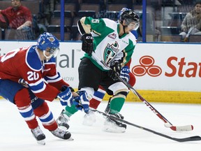 Edmonton's Mads Eller and Prince Albert's Tomas Andrlik have their eyes on the puck Tuesday at Rexall Place (Ian Kucerak, Edmonton Sun).