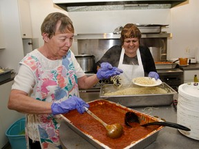 Volunteers Lorraine Genier and Valerie Vachon serve up spaghetti during the fundraiser spaghetti dinner that was held for Richard Solomon and his family on Saturday Nov. 22 at the Knight's of Columbus Hall. Close to 400 people were served and proceeds of the dinner went to help the Solomon family with the expenses they have incurred during Richard's cancer treatments after being diagnosed with testicular cancer this past August.