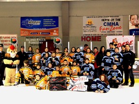 Members of the The Mattice-Moose and the Hearst-Assurance Aubin pose after the championship ship game during the DARE Tournament. The Peewee tournament was hosted by the Cochrane Minor Hockey Association and sponsored by the DARE program.