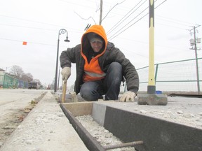 Co Langlois, with Southwest Fence and Decks, puts a form in place on Front Street to prepare for the pouring of concrete as work continues on replacement of the boardwalk. It is one of several city construction projects racing the coming winter weather. (PAUL MORDEN, The Observer)