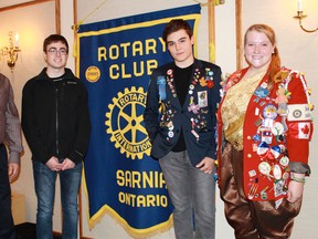 Sarnia Rotary Club President Lawrie Lachapelle stands with Rotary Youth Exchange students of the future, present and past at the club's Nov. 24 meeting. From left to right: Lachapelle, Kevin Soetemans, Gustavo Lopes and Katie Brandon. (CARL HNATYSHYN, QMI Agency)