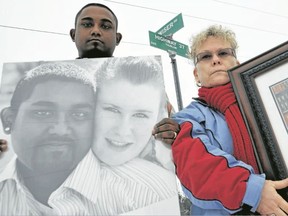 Imran Manan and Linda Henderson stand next to the Highway 37 and Wiser Road intersection in Corbyville, north of Belleville, Ont. where Manan's wife and Henderson's daughter, Andrea Manan, 27, of Frankford, Ont. was one of two women killed in the three-vehicle collision on Dec. 20, 2011. The family visited the scene back in December 2011. - THE INTELLIGENCER FILE PHOTO/QMI AGENCY