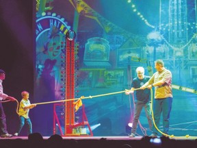 Jamie Hyneman, far left, and Adam Savage, wearing glasses on the right, with audience members on stage in their live show, Mythbusters: Behind the Myths. They?re at Budweiser Gardens? RBC Theatre Sunday. (? 2012 DavidAllenStudio.com)