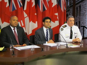 Tourism, Culture and Sport Minister Michael Coteau, left, Community Safety Minister Yasir Naqvi and OPP Deputy Commissioner Brad Blair answer questions about the Pan Am Games security budget on Wednesday, November 26 2014 (Antonella Artuso/Toronto Sun)