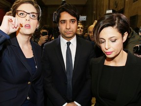 Jian Ghomeshi leaves College Park Court with lawyer Marie Henein, right, and co-counsel Danielle Robitaille, left, after being freed on bail on Wednesday, November 26, 2014. (Craig Robertson/Toronto Sun)