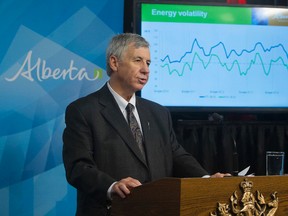 Alberta's Minister of Finance Robin Campbell speaks to the media about the government's 2014-15 second quarter fiscal update and economic statement at the Alberta Legislature, in Edmonton Alta., on Wednesday Nov. 26, 2014. David Bloom/Edmonton Sun